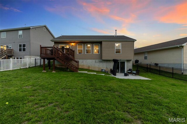 111 Hammond Dr, Herculaneum, MO 63048 - back of property with stairway, a wooden deck, and a patio