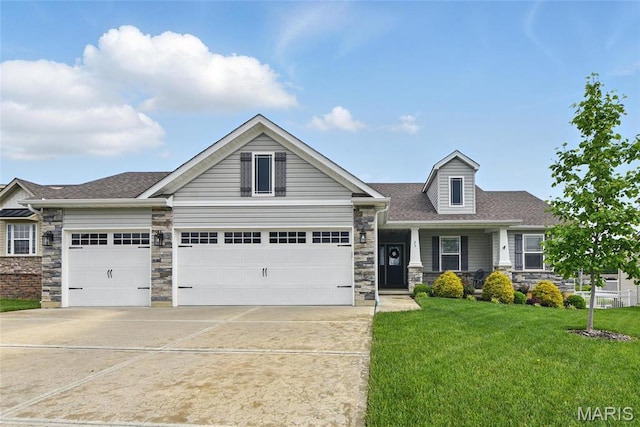 23 Austin Oaks Dr, Moscow Mills, MO 63362 - craftsman-style house with stone siding, concrete driveway, a front lawn, a garage, and a shingled roof