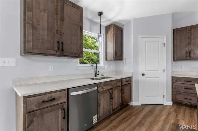 943 Stone Gate Dr, De Soto, MO 63020 - kitchen featuring dishwasher, a sink, dark wood-style floors, light countertops, and decorative light fixtures