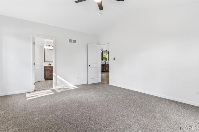 943 Stone Gate Dr, De Soto, MO 63020 - unfurnished bedroom featuring carpet, lofted ceiling, baseboards, ensuite bath, and ceiling fan