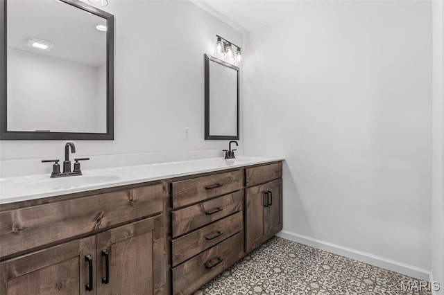 943 Stone Gate Dr, De Soto, MO 63020 - bathroom with double vanity, baseboards, and tile patterned floors