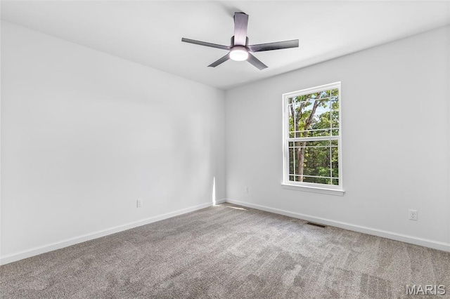 943 Stone Gate Dr, De Soto, MO 63020 - carpeted spare room with baseboards and a ceiling fan