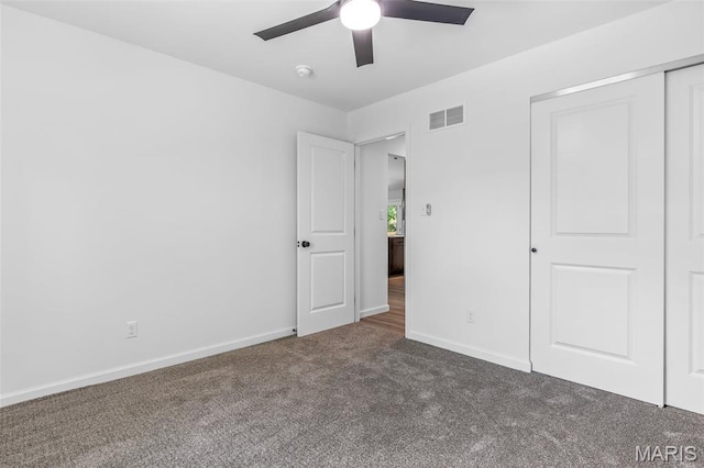 943 Stone Gate Dr, De Soto, MO 63020 - unfurnished bedroom with carpet, baseboards, a ceiling fan, and a closet