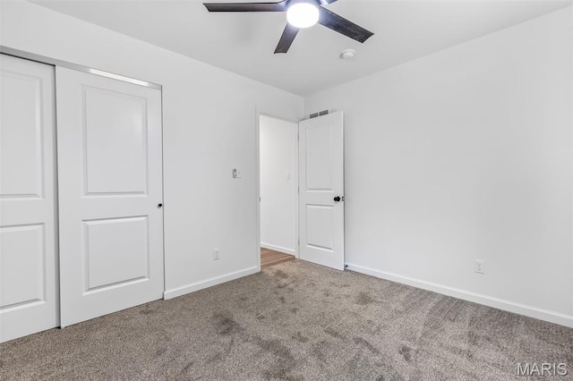943 Stone Gate Dr, De Soto, MO 63020 - unfurnished bedroom with carpet flooring, baseboards, a closet, and ceiling fan
