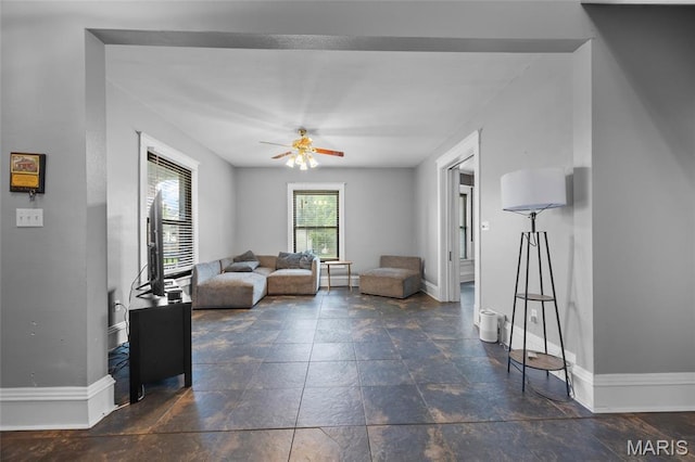 27 N Taylor Ave, Crystal City, MO 63019 - living area featuring a ceiling fan and baseboards