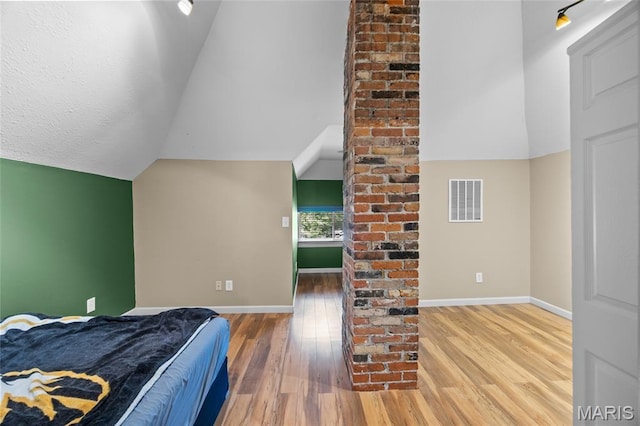 27 N Taylor Ave, Crystal City, MO 63019 - bedroom with wood finished floors, baseboards, and lofted ceiling