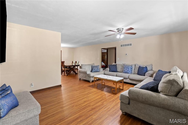 511 Ruddy Ct, Troy, IL 62294 - living area featuring wood finished floors, a ceiling fan, and baseboards