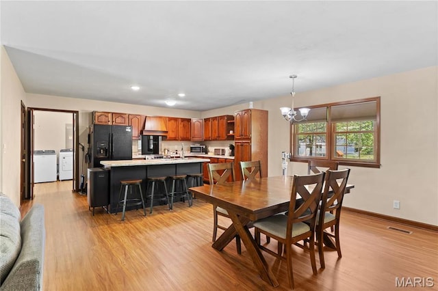 511 Ruddy Ct, Troy, IL 62294 - dining space featuring independent washer and dryer, a chandelier, light wood-style flooring, baseboards, and recessed lighting