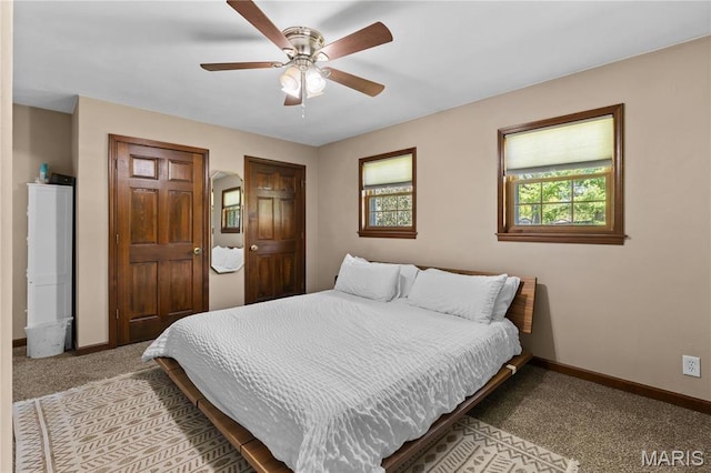 511 Ruddy Ct, Troy, IL 62294 - bedroom featuring carpet flooring, baseboards, ceiling fan, and two closets