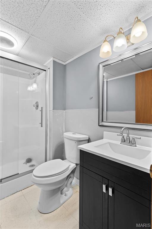 511 Ruddy Ct, Troy, IL 62294 - bathroom with a shower stall, vanity, and toilet