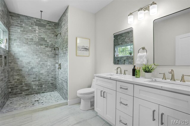 683 Bellerive Estates Dr, Saint Louis, MO 63141 - full bathroom featuring a tile shower, double vanity, and toilet