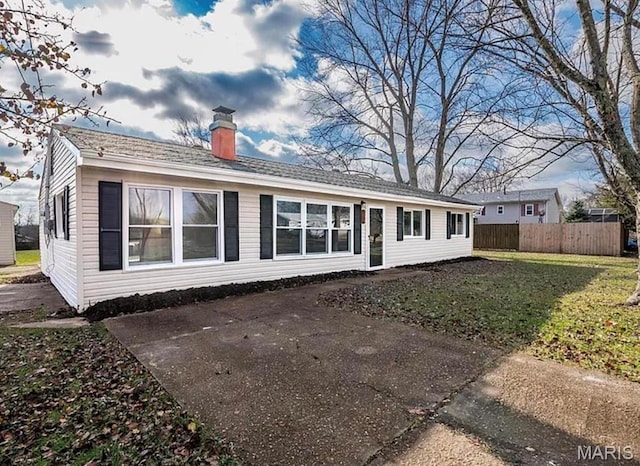 5108 S Gem Dr, High Ridge, MO 63049 - back of property with a chimney