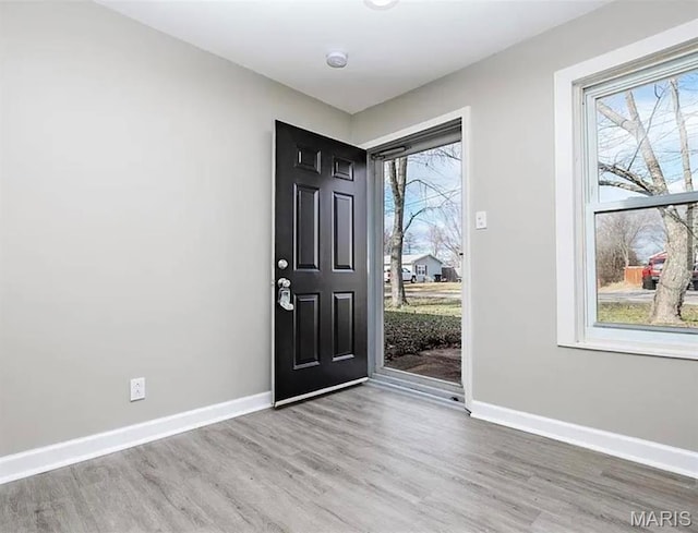 5108 S Gem Dr, High Ridge, MO 63049 - foyer entrance featuring wood finished floors and baseboards