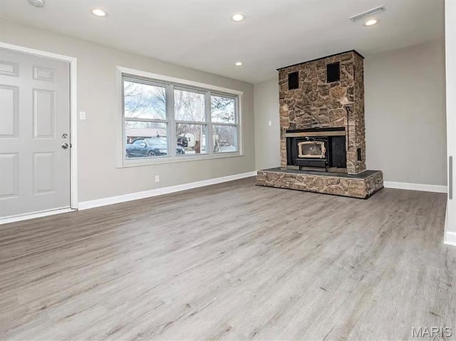 5108 S Gem Dr, High Ridge, MO 63049 - unfurnished living room with wood finished floors, recessed lighting, and a fireplace