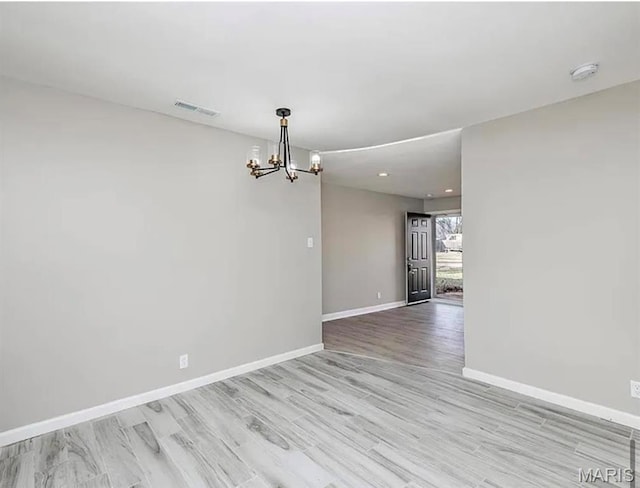 5108 S Gem Dr, High Ridge, MO 63049 - empty room with a chandelier, a smoke detector, light wood finished floors, and recessed lighting