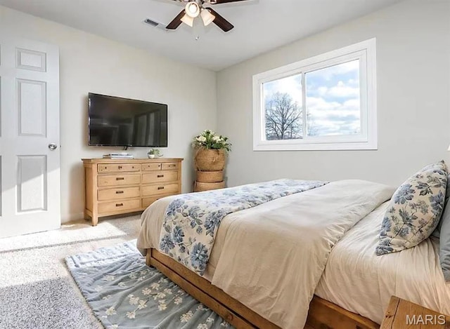 5108 S Gem Dr, High Ridge, MO 63049 - carpeted bedroom with a ceiling fan