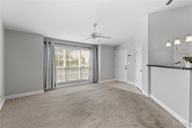 84 Timber Creek Dr Unit 8D, Ofallon, MO 63368 - unfurnished room featuring a ceiling fan, carpet, baseboards, and vaulted ceiling