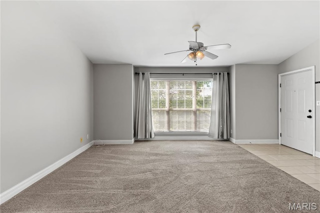 84 Timber Creek Dr Unit 8D, Ofallon, MO 63368 - carpeted empty room featuring ceiling fan, baseboards, and tile patterned flooring