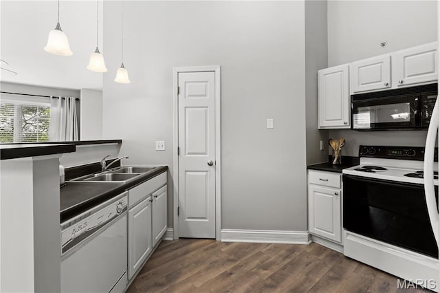 84 Timber Creek Dr Unit 8D, Ofallon, MO 63368 - kitchen with black microwave, white dishwasher, electric range oven, dark countertops, and a sink
