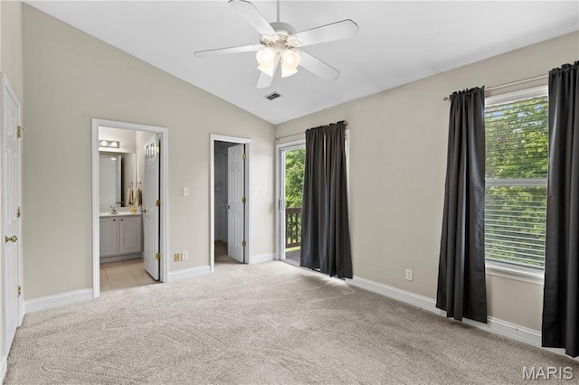 84 Timber Creek Dr Unit 8D, Ofallon, MO 63368 - unfurnished bedroom featuring light colored carpet, lofted ceiling, baseboards, a walk in closet, and connected bathroom