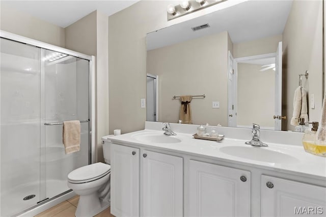 84 Timber Creek Dr Unit 8D, Ofallon, MO 63368 - bathroom featuring a shower stall, toilet, double vanity, and tile patterned flooring