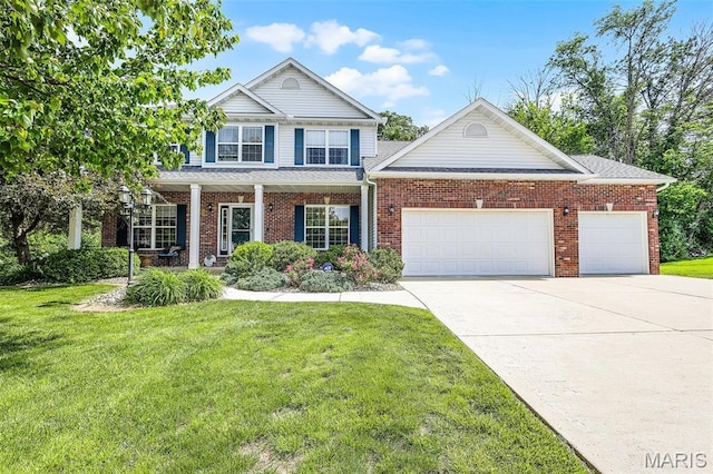 30 Shiloh Ct, Edwardsville, IL 62025 - traditional-style home with a garage, concrete driveway, a front lawn, and covered porch