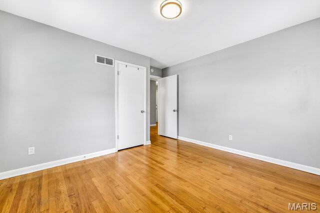 7114 Clayton Rd, Saint Louis, MO 63117 - empty room with baseboards and light wood-style floors