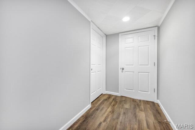 7114 Clayton Rd, Saint Louis, MO 63117 - corridor with dark wood-type flooring and baseboards