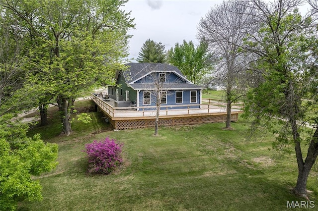 1431 Higway 104, Quincy, IL 62305 - view of front of home with a wooden deck and a front lawn