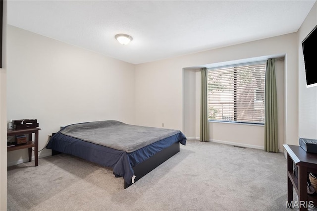 5567 Waterman Blvd Unit D, Saint Louis, MO 63112 - carpeted bedroom featuring baseboards