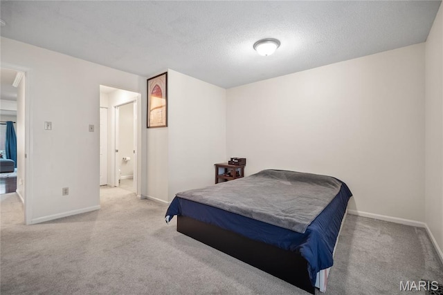 5567 Waterman Blvd Unit D, Saint Louis, MO 63112 - carpeted bedroom featuring baseboards and a textured ceiling
