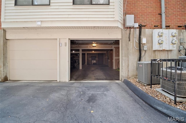 5567 Waterman Blvd Unit D, Saint Louis, MO 63112 - garage with cooling unit and asphalt driveway
