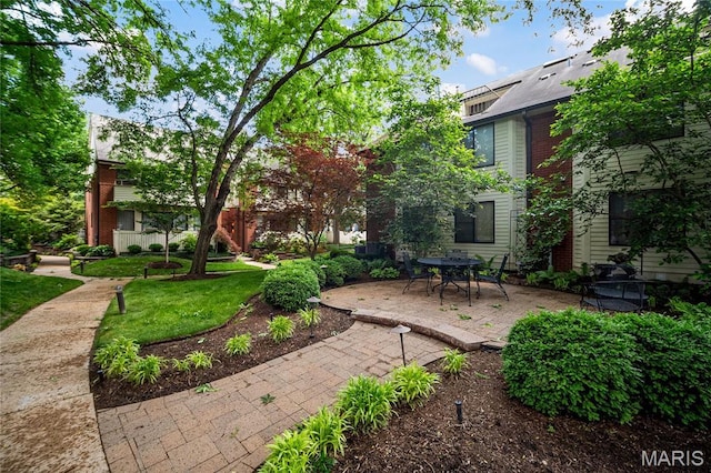 5567 Waterman Blvd Unit D, Saint Louis, MO 63112 - view of green lawn featuring a patio