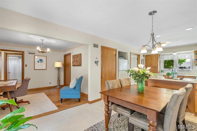 10710 Winthrop Ct, Saint Louis, MO 63123 - dining area featuring a chandelier and light floors