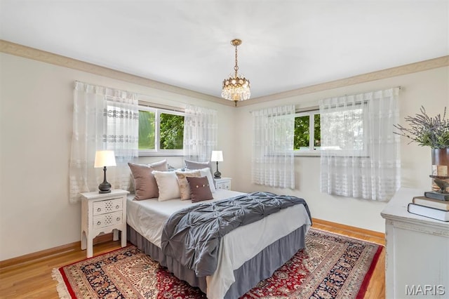 10710 Winthrop Ct, Saint Louis, MO 63123 - bedroom featuring a chandelier and wood finished floors