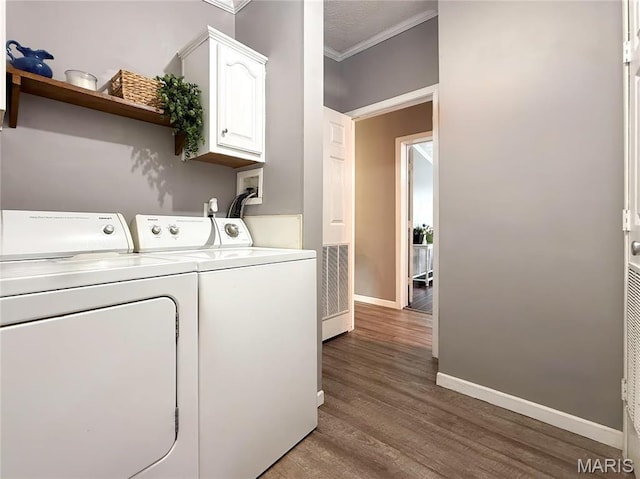 4311 Lakeview Dr, Hillsboro, MO 63050 - washroom with cabinet space, ornamental molding, independent washer and dryer, baseboards, and wood finished floors