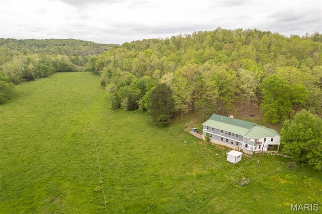 view from above of property with a forest