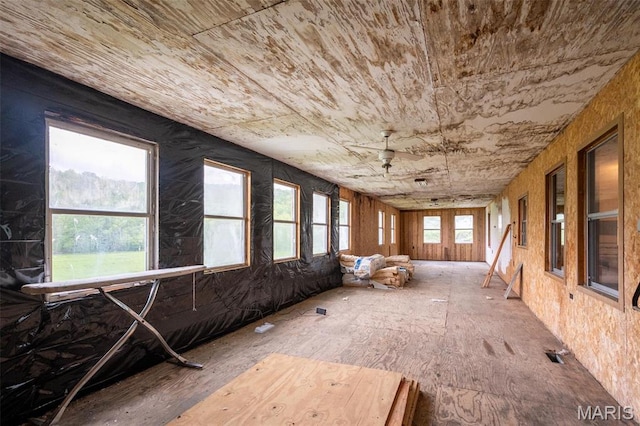 unfurnished sunroom with healthy amount of natural light