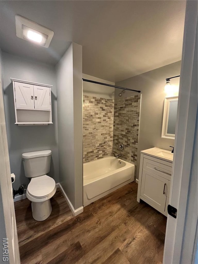 721 Woodland Ave, Festus, MO 63028 - bathroom featuring wood finished floors, vanity, toilet, and shower / tub combination