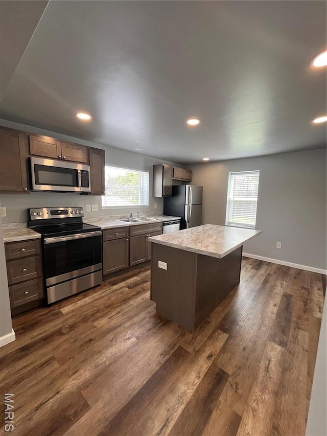 721 Woodland Ave, Festus, MO 63028 - kitchen with stainless steel appliances, plenty of natural light, light countertops, a kitchen island, and recessed lighting