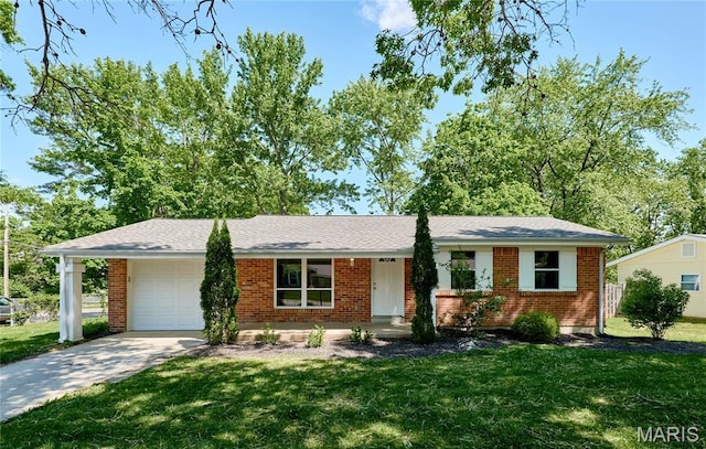 ranch-style home with an attached garage, concrete driveway, a front yard, and brick siding