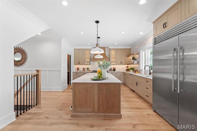 601 Foote Ave, Webster Groves, MO 63119 - kitchen with stainless steel built in refrigerator, light countertops, decorative backsplash, a kitchen island, and pendant lighting