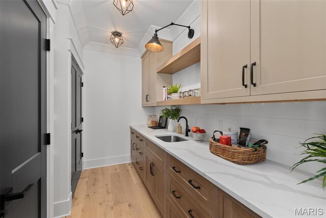601 Foote Ave, Webster Groves, MO 63119 - kitchen with a sink, open shelves, light wood-type flooring, and light stone countertops
