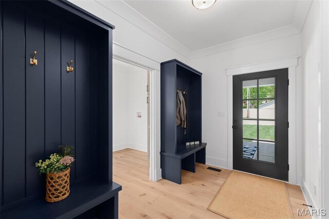 601 Foote Ave, Webster Groves, MO 63119 - mudroom with light wood finished floors, ornamental molding, and baseboards