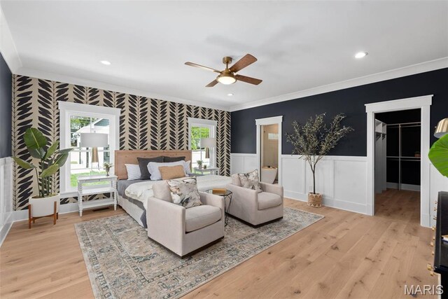 601 Foote Ave, Webster Groves, MO 63119 - bedroom with crown molding, a wainscoted wall, light wood-style flooring, a walk in closet, and recessed lighting