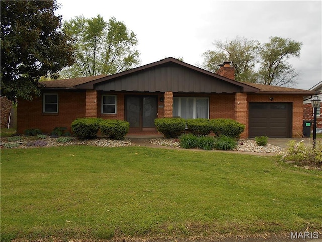 2408 Morrison Rd, Granite City, IL 62040 - single story home featuring a garage, brick siding, a chimney, a front yard, and french doors