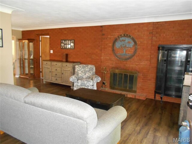 2408 Morrison Rd, Granite City, IL 62040 - living area featuring wood finished floors, a brick fireplace, and ornamental molding