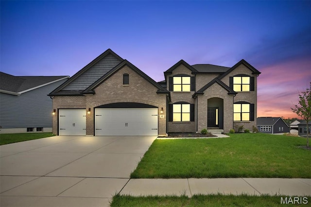 112 Westhaven View Dr, Wentzville, MO 63385 - french provincial home with a garage, concrete driveway, a front yard, and brick siding