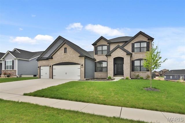 112 Westhaven View Dr, Wentzville, MO 63385 - french country style house with brick siding, concrete driveway, an attached garage, and a front lawn