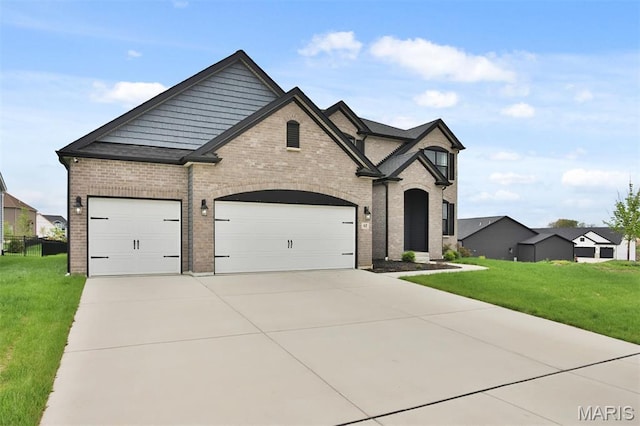 112 Westhaven View Dr, Wentzville, MO 63385 - french country home with brick siding, driveway, a front lawn, and an attached garage